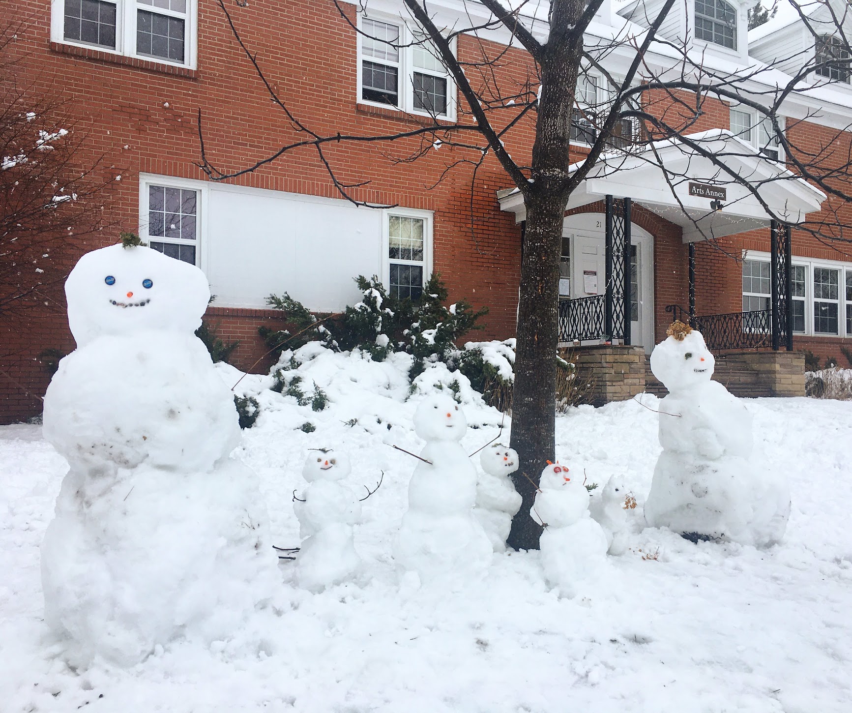 A snow family in front of the Arts Annex at St. Lawrence University 