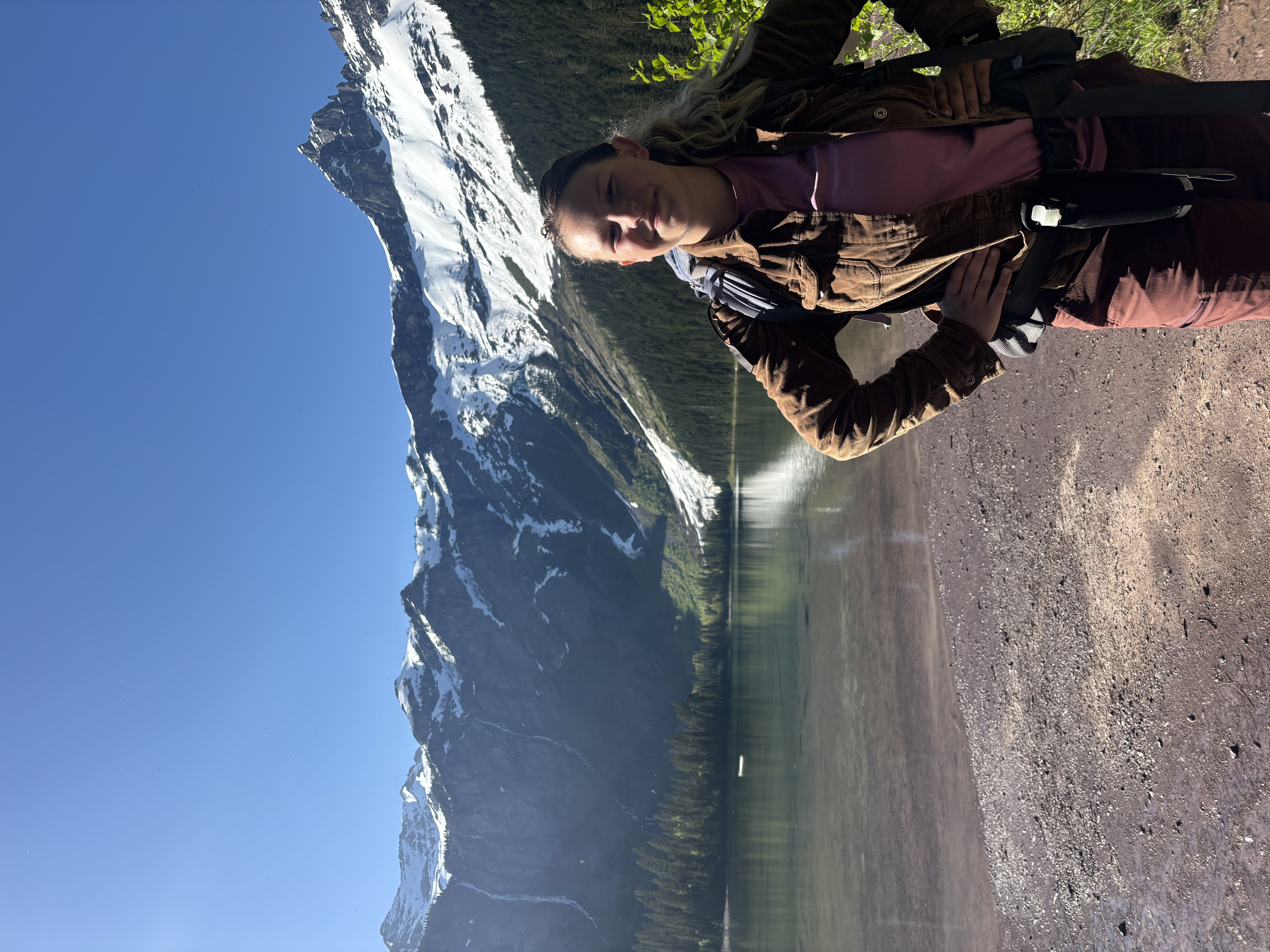Photo of Emily on a hike at a glacial lake