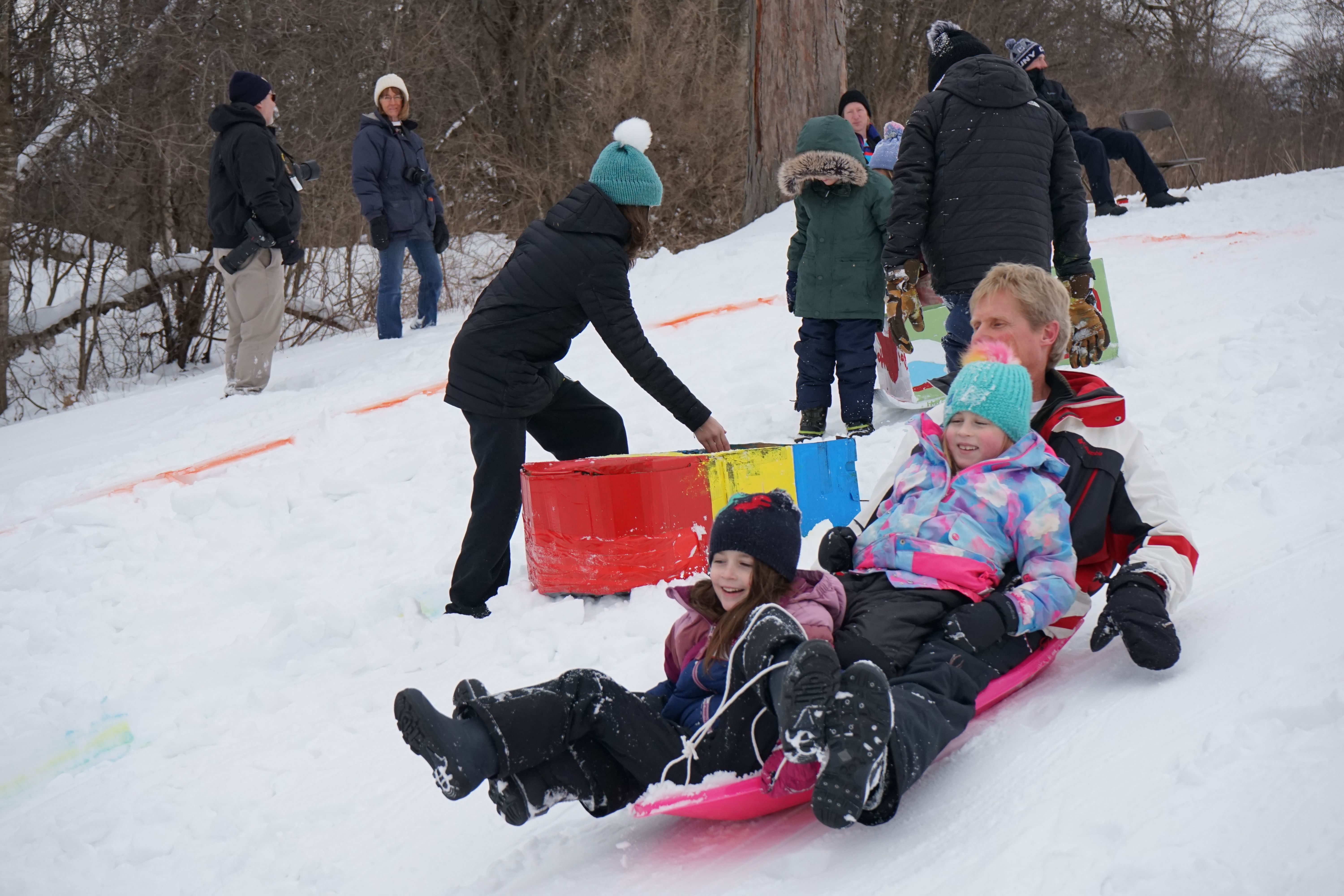 Children sledding in the snow