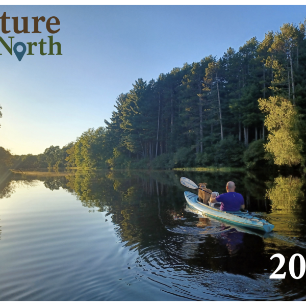 Image of 2023 calendar cover photo - man paddling kayak 
