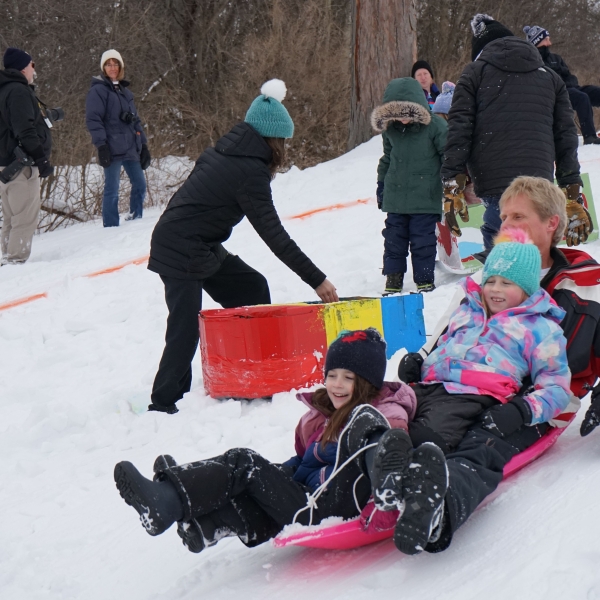 Children sledding in the snow