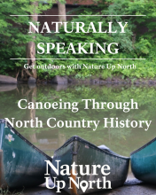Naturally Speaking Canoeing through north country history nature up north in white text overlaid on an image of three canoes on the bank of a murky river