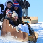 College team Calc-U-SUS from Clarkson goes for one last slide in their slightly tattered cardboard sled