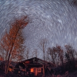 A long exposure shot of stars the movement of stars throughout the night sky.