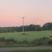 Sunset in a field with a yellow full moon