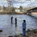 St. Lawrence students wade in the Grasse River to collect water data.