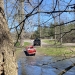 Car/Boat backing into the little river.